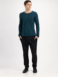 Modern, easy-fit style is wider through hips, tapered to the ankle.Buttoned waistbandFront zipperFront pleatsSide pocketsInseam, about 35CottonDry cleanMade in Italy Modern, easy-fit style is wider through hips, tapered to the ankle.Buttoned waistbandFront zipperFront pleatsSide pocketsInseam, about 35CottonDry cleanMade in Italy