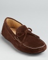 Treat your feet to this luxe suede loafer, finished with a stitched moc toe and tie detail at the tongue.