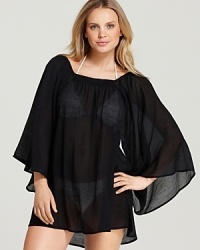 In a glamorous, shimmering fabric, Magicsuit's luxe tunic coverup lends a dressed up look. With a squared neckline and full, flared sleeves, this swimwear essential elevates your poolside style. In a glamorous, shimmering fabric, Magicsuit's luxe tunic coverup lends a dressed up look. With a squared neckline and full, flared sleeves, this swimwear essential elevates your poolside style.