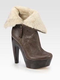Crackled leather is paired with ultra-soft shearling in this foldover design, lifted by a wooden horn heel and platform. Wooden heel, 5½ (140mm)Wooden platform, 1½ (40mm)Compares to a 4 heel (100mm)Leather and shearling upperSide zipShearling linedLeather solePadded insoleImported Crackled leather is paired with ultra-soft shearling in this foldover design, lifted by a wooden horn heel and platform. Wooden heel, 5½ (140mm)Wooden platform, 1½ (40mm)Compares to a 4 heel (100mm)Leather and shearling upperSide zipShearling linedLeather solePadded insoleImported