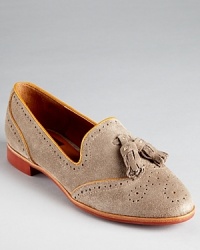 Adopt an ivy league look with DV Dolce Vita's bookish Millie loafers--these academia-bound slip-ons get trend right with wingtip perforation and tassel details. Adopt an ivy league look with DV Dolce Vita's bookish Millie loafers--these academia-bound slip-ons get trend right with wingtip perforation and tassel details.