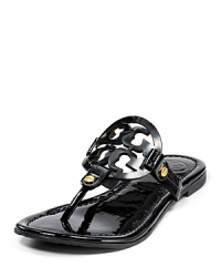 Tory Burch Miller signature flat sandals. Laser cut logo and gold tone hardware on these dainty, colorful sandals. Tory Burch Miller signature flat sandals. Laser cut logo and gold tone hardware on these dainty, colorful sandals.