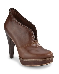 High style, hidden comfort: these sleek platform booties feature signature UGG® Australia genuine shearling linings. High style, hidden comfort: these sleek platform booties feature signature UGG® Australia genuine shearling linings.