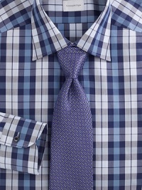 An elegant medallion design crafted in superior silk. A fine geometric design defines a superior silk tie. Silk Dry clean Made in Italy An elegant medallion design crafted in superior silk. A fine geometric design defines a superior silk tie. Silk Dry clean Made in Italy