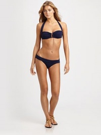 A charming oval center gives this ruched design a seductive look. The fold-over waistband offers the perfect fit with coveted stretch.Bandeau topWide halter strap ties at neckHidden underwireBack tie closureSeamless, low-rise hipsterEuropean cutFully lined89% polyamide/11% elastaneHand washMade in Italy A charming oval center gives this ruched design a seductive look. The fold-over waistband offers the perfect fit with coveted stretch.Bandeau topWide halter strap ties at neckHidden underwireBack tie closureSeamless, low-rise hipsterEuropean cutFully lined89% polyamide/11% elastaneHand washMade in Italy