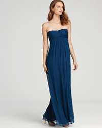 Master streamlined elegance in this Amsale strapless gown, flaunting a famously flattering empire waist. Master streamlined elegance in this Amsale strapless gown, flaunting a famously flattering empire waist.