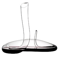 The alluring Mamba is redolent of a sleek mamba snake. As the wine flows through every bend it is double-decanted, opening up upon entering the decanter, achieving what would take hours of decanting in a typical bowl-shaped carafe. Mirroring the snakes poised upright stance, its coiled base creates a series of air pockets which charge the wine as it moves towards the elegant upright neck upon pouring. The alluring Mamba is redolent of a sleek mamba snake. As the wine flows through every bend it is double-decanted, opening up upon entering the decanter, achieving what would take hours of decanting in a typical bowl-shaped carafe. Mirroring the snakes poised upright stance, its coiled base creates a series of air pockets which charge the wine as it moves towards the elegant upright neck upon pouring.