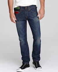 True Religion introduces a splash of color on the front and back of these slim straight fitting jeans, a welcome interruption in the world of straightforward denim. True Religion introduces a splash of color on the front and back of these slim straight fitting jeans, a welcome interruption in the world of straightforward denim.