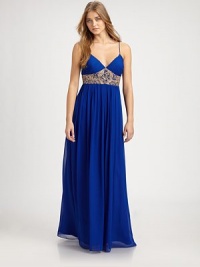 Intricate beading adorns the waist of this floor-length chiffon style.Sweetheart necklineSpaghetti strapsBeaded empire waistConcealed back zipFully linedAbout 45 from natural waistPolyesterSpot cleanImportedModel shown is 5'10 (177cm) wearing US size 4. Intricate beading adorns the waist of this floor-length chiffon style.Sweetheart necklineSpaghetti strapsBeaded empire waistConcealed back zipFully linedAbout 45 from natural waistPolyesterSpot cleanImportedModel shown is 5'10 (177cm) wearing US size 4.