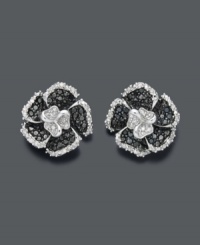 Stunning in stark contrast, these flower studs glimmer with black diamonds (1/3 ct. t.w.) and white round-cut diamonds (1/8 ct. t.w.). Earrings crafted in sterling silver. Approximate diameter: 1/4 inch. Stunning in stark contrast, these flower studs glimmer with black diamonds (1/3 ct. t.w.) and white round-cut diamonds (1/8 ct. t.w.). Earrings crafted in sterling silver. Approximate diameter: 1/4 inch.