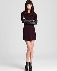 An AIKO jersey dress takes on the season's downtown attitude with edgy leather patches at the sleeves and a sleek silhouette. Moto boots finish the look off with a rebellious vibe. An AIKO jersey dress takes on the season's downtown attitude with edgy leather patches at the sleeves and a sleek silhouette. Moto boots finish the look off with a rebellious vibe.