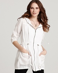 Channel the sport-chic aesthetic with this Eileen Fisher jacket that flaunts sleek silver accents against a clean white silhouette. Channel the sport-chic aesthetic with this Eileen Fisher jacket that flaunts sleek silver accents against a clean white silhouette.