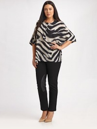 Made from irresistible Italian silk, this zebra-print top offers you a comfortable fit, thanks to convenient side slits. Round neckElbow-length sleevesConcealed button placketPull-on styleAllover printRelaxed fitSide slitsAbout 32 from shoulder to hemSilkDry cleanImported of Italian fabric
