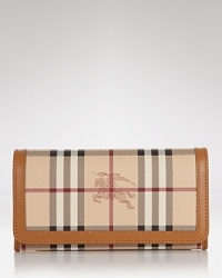 Burberry polishes off practical style with this billfold wallet. Crafted from durable cotton and ideally sized to tuck inside a purse, it's sure to keep your essentials in check. Burberry polishes off practical style with this billfold wallet. Crafted from durable cotton and ideally sized to tuck inside a purse, it's sure to keep your essentials in check.