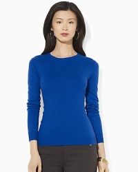 A lustrous silk and cashmere construction lends sultry appeal to a classic crewneck sweater. A lustrous silk and cashmere construction lends sultry appeal to a classic crewneck sweater.