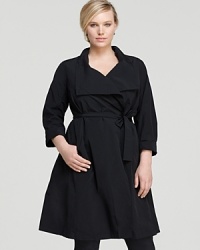 Embrace rainy days with this Eileen Fisher Plus trench coat, flaunting a cascading collar and flattering tie waist for feminine appeal. Embrace rainy days with this Eileen Fisher Plus trench coat, flaunting a cascading collar and flattering tie waist for feminine appeal.