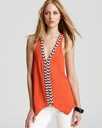 With tribal print trending, it's no wonder this Parker top makes the must-have list of fashion's chicest this season. Flaunting intricate beading for an eye-catching look, this lush silk silhouette achieves standout status every time. With tribal print trending, it's no wonder this Parker top makes the must-have list of fashion's chicest this season. Flaunting intricate beading for an eye-catching look, this lush silk silhouette achieves standout status every time.