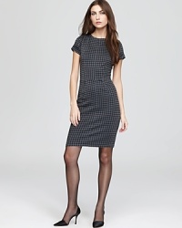 Cut a chic silhouette in this fitted Aqua dress flaunting flattering seaming details and a classic houndstooth print. Complement this ladylike look with tights and classic pumps. Cut a chic silhouette in this fitted Aqua dress flaunting flattering seaming details and a classic houndstooth print. Complement this ladylike look with tights and classic pumps.
