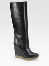 A distinct rubber platform lifts this luxe seasonal leather essential with a covered wedge. Self-covered wedge, 4½ (115mm)Rubber platform, 1 (25mm)Compares to a 3½ heel (90mm)Shaft, 14½Leg circumference, 14Leather upperPull-on styleLeather liningRubber solePadded insoleMade in Italy A distinct rubber platform lifts this luxe seasonal leather essential with a covered wedge. Self-covered wedge, 4½ (115mm)Rubber platform, 1 (25mm)Compares to a 3½ heel (90mm)Shaft, 14½Leg circumference, 14Leather upperPull-on styleLeather liningRubber solePadded insoleMade in Italy