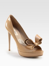 Lustrous patent leather forms this peep toe silhouette with a dimensional bow and sturdy platform. Self-covered heel, 5 (125mm)Covered platform, ¾ (20mm)Compares to a 4¼ heel (110mm)Patent leather upperPeep toeLeather lining and solePadded insoleMade in Italy Lustrous patent leather forms this peep toe silhouette with a dimensional bow and sturdy platform. Self-covered heel, 5 (125mm)Covered platform, ¾ (20mm)Compares to a 4¼ heel (110mm)Patent leather upperPeep toeLeather lining and solePadded insoleMade in Italy