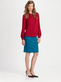Billowy silhouette and bishop sleeves add '70s flair to this silk-rich staple. Split roundneck with button closuresLong bishop sleevesButtoned cuffs95% silk/5% spandexDry cleanImportedModel shown is 5'9 (175cm) wearing US size 4. Billowy silhouette and bishop sleeves add '70s flair to this silk-rich staple. Split roundneck with button closuresLong bishop sleevesButtoned cuffs95% silk/5% spandexDry cleanImportedModel shown is 5'9 (175cm) wearing US size 4.
