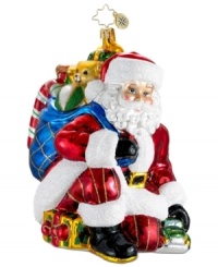 Santa test drives a new toy car in this magical holiday moment captured by Christopher Radko. Hand-painted glass shines with impressive detail, from St. Nick's pinstripe pants to his bag of presents. Santa test drives a new toy car in this magical holiday moment captured by Christopher Radko. Hand-painted glass shines with impressive detail, from St. Nick's pinstripe pants to his bag of presents.