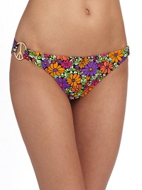 Oversized peace rings add instant glamour to this vibrant floral knit.Elastic waistband Goldtone peace rings at sides Elastic edges Fully lined 82% nylon/18% spandex Fully lined Hand wash Made in USA of imported fabricPlease note: Bikini top sold separately. Oversized peace rings add instant glamour to this vibrant floral knit.Elastic waistband Goldtone peace rings at sides Elastic edges Fully lined 82% nylon/18% spandex Fully lined Hand wash Made in USA of imported fabricPlease note: Bikini top sold separately.