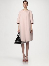 This soft, sculptural angora silhouette has a decidedly retro sensibility.Band collarThree-quarter sleevesConcealed front closures78% angora/22% woolDry cleanMade in ItalyModel shown is 5'11 (180cm) wearing US size 4. This soft, sculptural angora silhouette has a decidedly retro sensibility.Band collarThree-quarter sleevesConcealed front closures78% angora/22% woolDry cleanMade in ItalyModel shown is 5'11 (180cm) wearing US size 4.