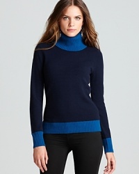 A modern classic, crisp color blocking takes a cashmere Jones New York Collection turtleneck from staple to statement. A modern classic, crisp color blocking takes a cashmere Jones New York Collection turtleneck from staple to statement.