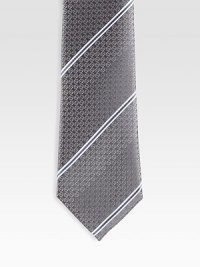 A signature tie handmade from fine Italian silk with diagonal stripes and subtle GG detail. Silk Dry clean Made in Italy A signature tie handmade from fine Italian silk with diagonal stripes and subtle GG detail. Silk Dry clean Made in Italy