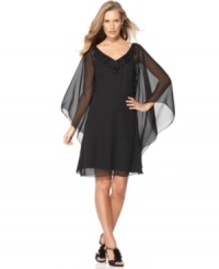Elegance and drama combine for this Adrianna Papell dress, featuring sheer, cape-like sleeves and a sparkling beaded neckline. Elegance and drama combine for this Adrianna Papell dress, featuring sheer, cape-like sleeves and a sparkling beaded neckline.