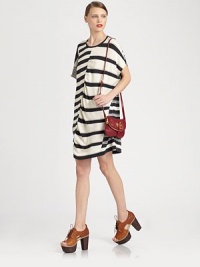 Multi-directional stripes, dropped shoulders and short dolman sleeves characterize this relaxed cotton silhouette. RoundneckDropped shouldersShort dolman sleevesAbout 18 from natural waistCottonDry cleanImportedModel shown is 5'10 (177cm) wearing US size XSmall/Small. Multi-directional stripes, dropped shoulders and short dolman sleeves characterize this relaxed cotton silhouette. RoundneckDropped shouldersShort dolman sleevesAbout 18 from natural waistCottonDry cleanImportedModel shown is 5'10 (177cm) wearing US size XSmall/Small.