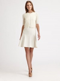 Finespun wool, knit in a bolero silhouette and fastened with a single snap closure at the neckline.Jewel necklineSingle button closureShort sleevesRib-knit edgesAbout 16 from shoulder to hemWoolDry cleanMade in SwitzerlandModel shown is 5'10 (177cm) wearing US size 4. Finespun wool, knit in a bolero silhouette and fastened with a single snap closure at the neckline.Jewel necklineSingle button closureShort sleevesRib-knit edgesAbout 16 from shoulder to hemWoolDry cleanMade in SwitzerlandModel shown is 5'10 (177cm) wearing US size 4.