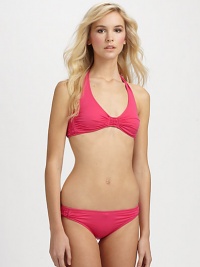 A flattering halter design with pretty gathered details to complement the shape.Halter strap ties at neckRemovable cupsBack tie closureGathered sides92% nylon/8% spandexFully linedHand washImported Please note: Bikini bottom sold separately. A flattering halter design with pretty gathered details to complement the shape.Halter strap ties at neckRemovable cupsBack tie closureGathered sides92% nylon/8% spandexFully linedHand washImported Please note: Bikini bottom sold separately.