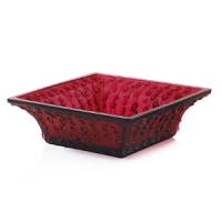 The Roses bowl in rouge a l'or presents a double feat in crystal design. The rich, red color, created with a mixture of red & gold pigments is difficult to attain, while the square top takes a strict attention to detail. To achieve the square shape, the crystal must be perfectly pressed and molded to the four corners of the bowl.