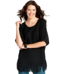 Wide dolman sleeves and a hem full of fringe make this NY Collection sweater the lovely, laid-back essential of the season. Wide dolman sleeves and a hem full of fringe make this NY Collection sweater the lovely, laid-back essential of the season.