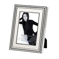 With a delicate inlay of ivory enamel over silver plating, this Vera Wang frame blends modern design with deco glamour for luxurious ambience. With a delicate inlay of ivory enamel over silver plating, this Vera Wang frame blends modern design with deco glamour for luxurious ambience.