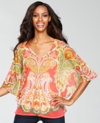 Bright color and a bold print combined with a fluid, flowing drape makes INC's top unique and so much fun to wear! Micro-studding in front adds a touch of shine, too. Bright color and a bold print combined with a fluid, flowing drape makes INC's top unique and so much fun to wear! Micro-studding in front adds a touch of shine, too.