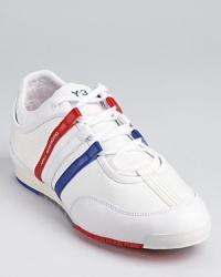 An updated Adidas style, with the classic triple stripe accent rendered in red, white and blue. An updated Adidas style, with the classic triple stripe accent rendered in red, white and blue.