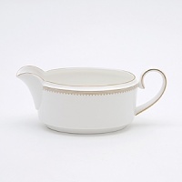 Rings of gold adorn fine white bone china with the lustrous shine of a wedding band. White bone china features two different border trims of gold, a wide corded border of textured grosgrain ribbon on some pieces, a narrow edge on others. Rings of gold adorn fine white bone china with the lustrous shine of a wedding band. White bone china features two different border trims of gold, a wide corded border of textured grosgrain ribbon on some pieces, a narrow edge on others.