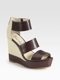 Canvas wedge design with wide leather straps and an exposed back zipper. Self-covered wedge, 4½ (115mm)Covered platform, 1½ (40mm)Compares to a 3 heel (75mm)Leather and canvas upperBack zipperLeather liningBuffed leather and rubber solePadded insoleImported Canvas wedge design with wide leather straps and an exposed back zipper. Self-covered wedge, 4½ (115mm)Covered platform, 1½ (40mm)Compares to a 3 heel (75mm)Leather and canvas upperBack zipperLeather liningBuffed leather and rubber solePadded insoleImported