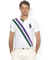 Designed exclusively for Ralph Lauren's collection celebrating the Wimbledon Championships, a classic short-sleeved polo shirt is tailored for a trim, athletic fit from breathable cotton mesh with preppy diagonal sash stripes. Designed exclusively for Ralph Lauren's collection celebrating the Wimbledon Championships, a classic short-sleeved polo shirt is tailored for a trim, athletic fit from breathable cotton mesh with preppy diagonal sash stripes.
