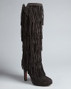 In a word, these boots rock. Boho-meets-Western, statement-making fringe takes this high heeled style to the top of the charts; by designer Jean-Michel Cazabat: Haute, haute, haute.