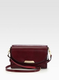 An elegant style in luxuriously smooth leather with a hidden, check print lining.Detachable adjustable leather shoulder strap, 20¾-23 dropMagnetic snap flap closureOne inside zip pocketTwo inside open pocketsCheck print lining10½W X 6½H X 2¾DImported An elegant style in luxuriously smooth leather with a hidden, check print lining.Detachable adjustable leather shoulder strap, 20¾-23 dropMagnetic snap flap closureOne inside zip pocketTwo inside open pocketsCheck print lining10½W X 6½H X 2¾DImported