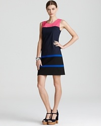 Vibrant stripes interrupt the sleek navy silhouette of this DKNY shift dress for vivid alternative to the classic LBD. Vibrant stripes interrupt the sleek navy silhouette of this DKNY shift dress for vivid alternative to the classic LBD.