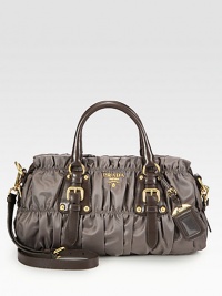 Leather accents add dimension to the classic ruched nylon design.Double leather top handles, 4 dropDetachable adjustable leather shoulder strap, 19-21 dropTop zip closureOne inside zip pocketOne inside open pocketSignature jacquard lining15W X 7¾H X 4½DMade in Italy Leather accents add dimension to the classic ruched nylon design.Double leather top handles, 4 dropDetachable adjustable leather shoulder strap, 19-21 dropTop zip closureOne inside zip pocketOne inside open pocketSignature jacquard lining15W X 7¾H X 4½DMade in Italy