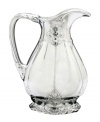 Hold court with the regal elegance of Fleur de Lis serveware and serving dishes. Lavish detail featuring the iconic French lily evokes another era, gleaming spectacularly in this magnificent pitcher from Arthur Court.