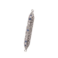 A beautiful wedding or house-warming gift this intricately detailed Mezuzah is accented by sapphire crystals. A beautiful wedding or house-warming gift this intricately detailed Mezuzah is accented by sapphire crystals.
