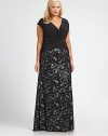 Made from soft jersey, this gown features a pleated bodice and printed skirt. You will adore the way the bodice complements your shape.V-necklineCap sleevesPleated bodiceRuched details at back zipperFully linedAbout 49 from natural waistBodice: polyester/spandexSkirt: viscose/elastaneDry cleanImported