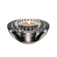 Embellished with intricately cut, angular facets that sparkle with reflected light, this votive candleholder from Orrefors adds an ornate element to the dining table. Embellished with intricately cut, angular facets that sparkle with reflected light, this votive candleholder from Orrefors adds an ornate element to the dining table.
